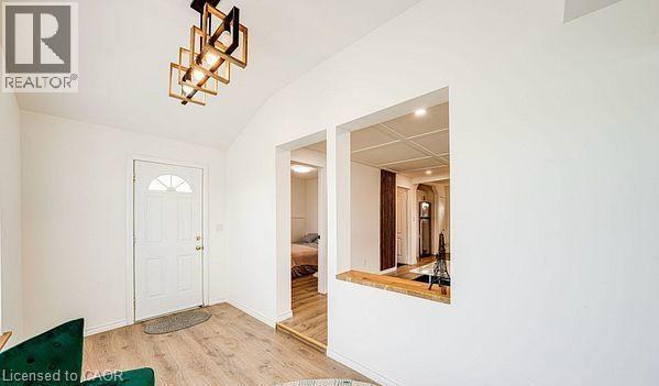 Entryway featuring a vaulted ceiling and wood-finish flooring - 43 Adair Avenue S, Hamilton, ON - Indoor Photo Showing Other Room