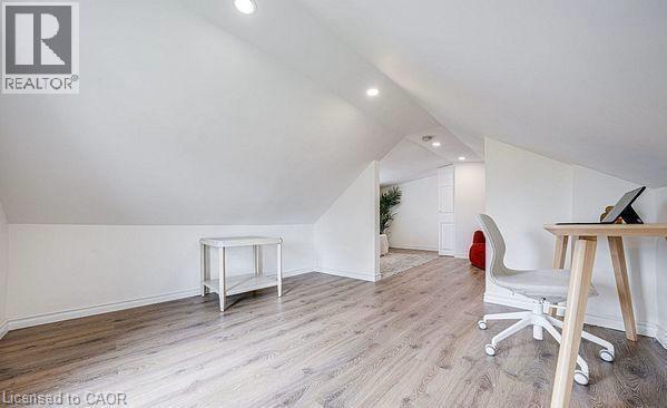 Sloped ceilings with recessed lighting define this versatile space - 43 Adair Avenue S, Hamilton, ON - Indoor