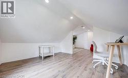 Sloped ceilings with recessed lighting define this versatile space -