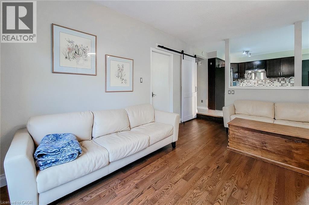 Hardwood flooring spans this room, featuring light-toned walls - 49 Ashwood Drive, Cambridge, ON - Indoor Photo Showing Living Room