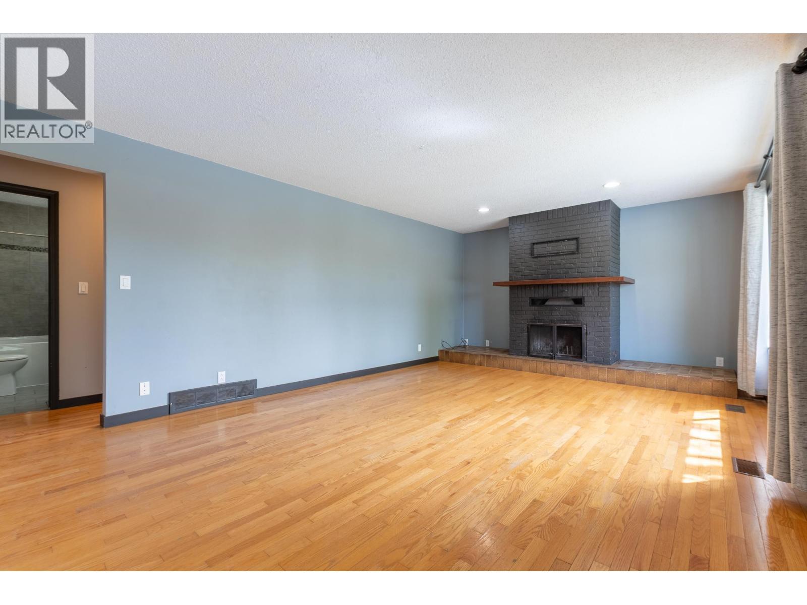 4608 Crocus Crescent, Prince George, BC - Indoor Photo Showing Living Room With Fireplace