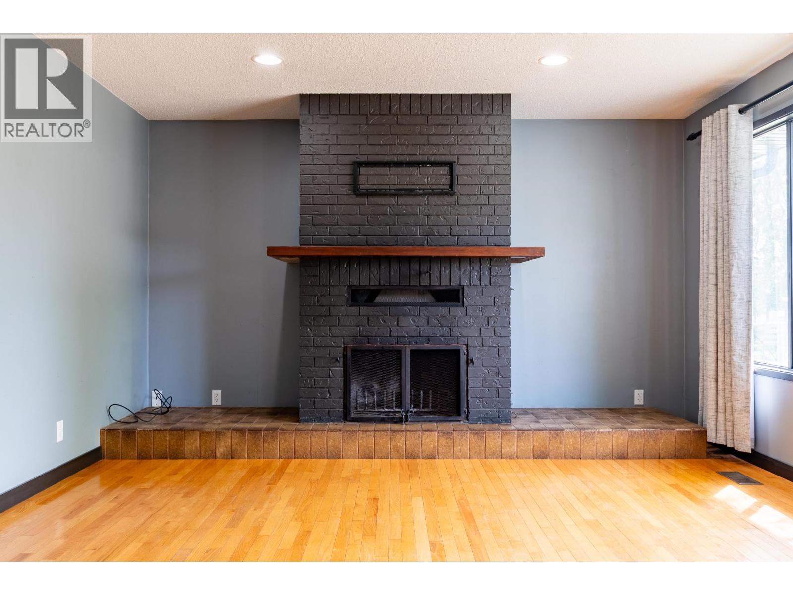 4608 Crocus Crescent, Prince George, BC - Indoor Photo Showing Living Room With Fireplace
