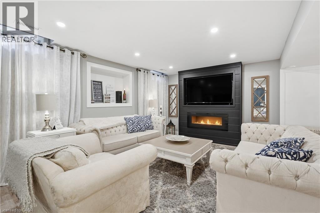 Rec Room Lower Level - 36 Pavilion Drive, Binbrook, ON - Indoor Photo Showing Living Room With Fireplace