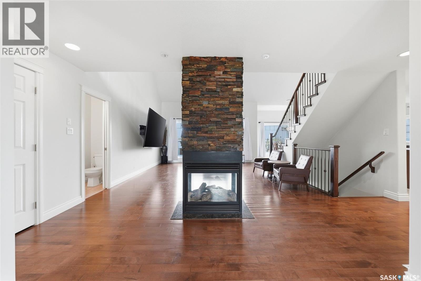 418 Nicklaus Drive, Warman, SK - Indoor Photo Showing Other Room With Fireplace