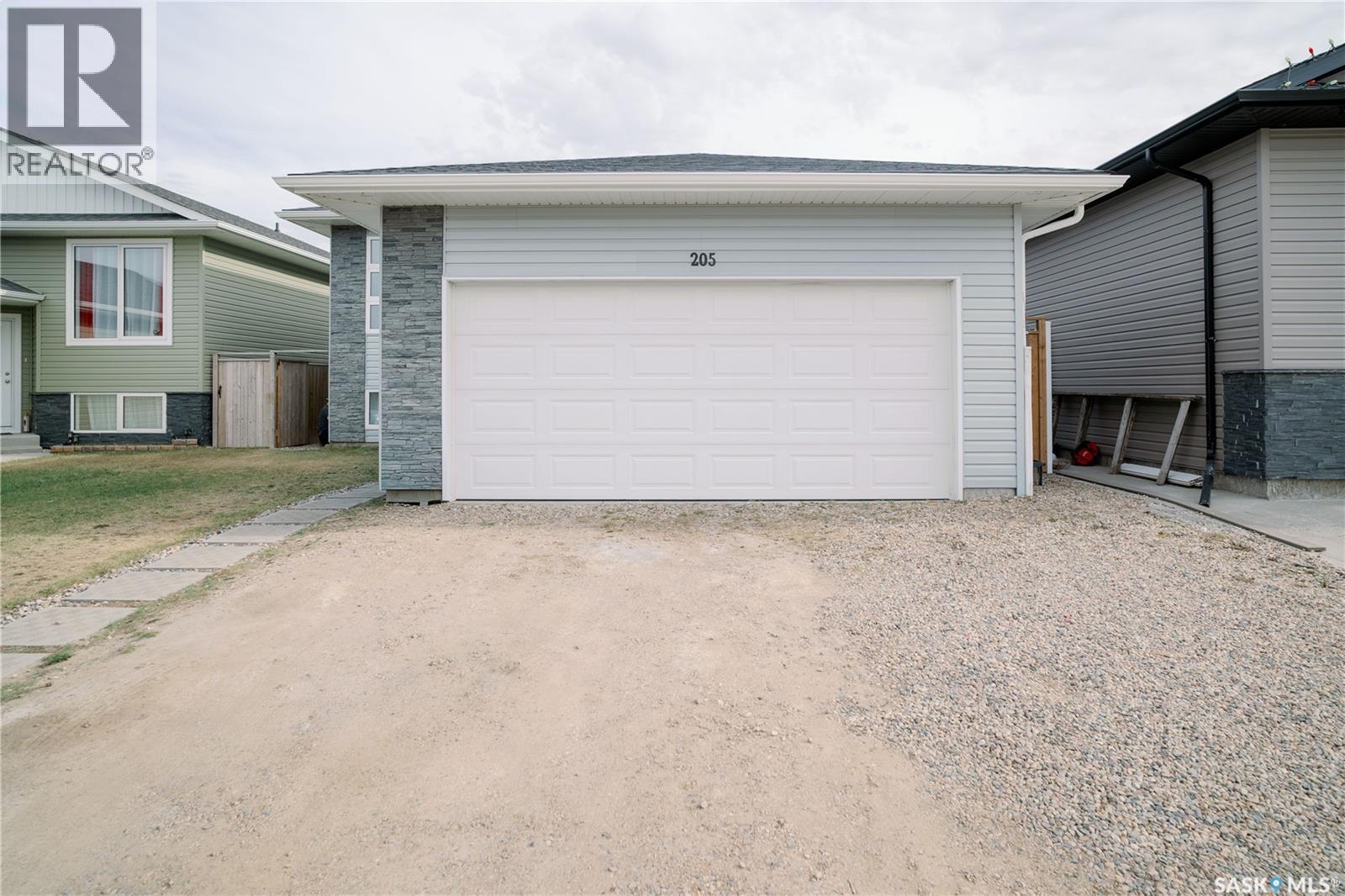 205 Reddekopp Lane, Warman, SK - Outdoor With Exterior