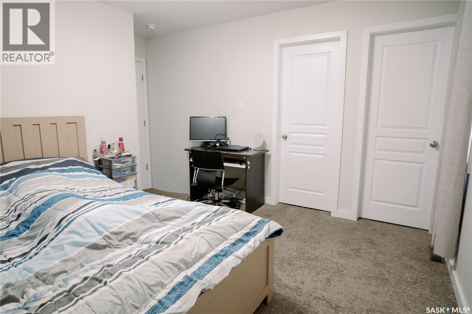 205 Reddekopp Lane, Warman, SK - Indoor Photo Showing Bedroom