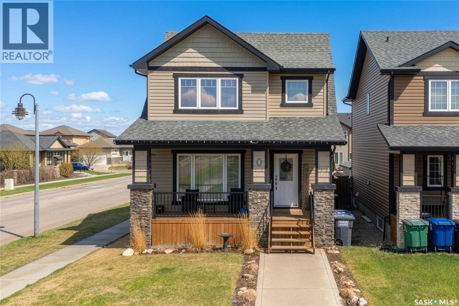 386 Levalley Cove, Saskatoon, SK - Outdoor With Deck Patio Veranda With Facade