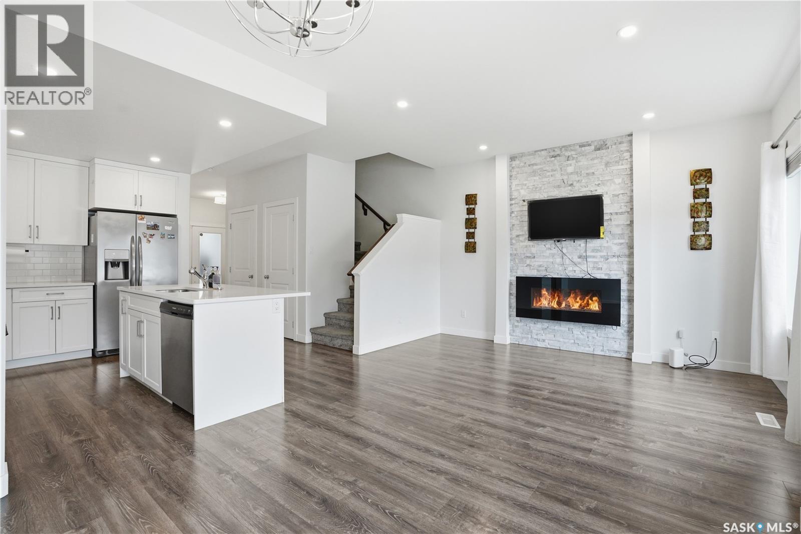 234 Brighton Gate, Saskatoon, SK - Indoor With Fireplace