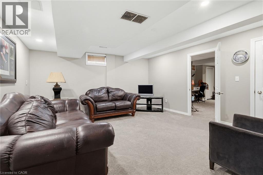 Carpeted recreation room with recessed lighting and a drop ceiling - 47 Hannah Crescent, Hamilton, ON - Indoor