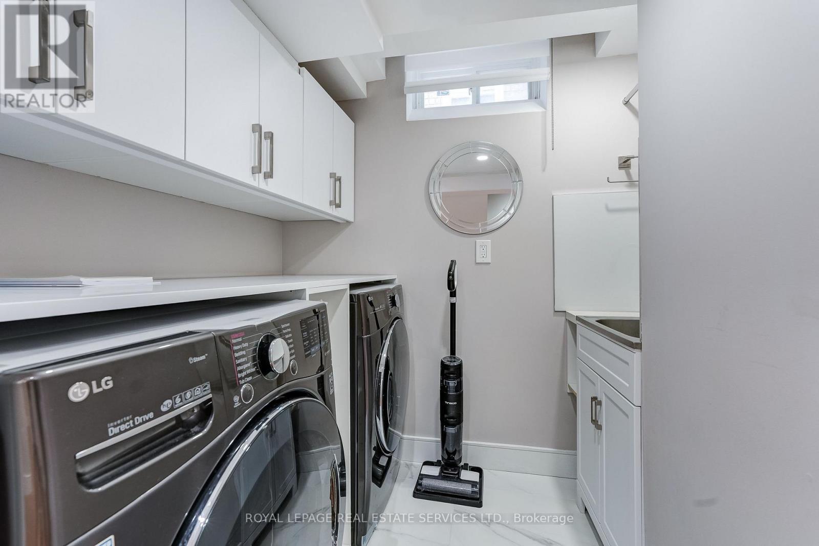 Basement Laundry Room Custom cabinetry - 3592 Cherrington Crescent, Mississauga, ON - Indoor Photo Showing Laundry Room