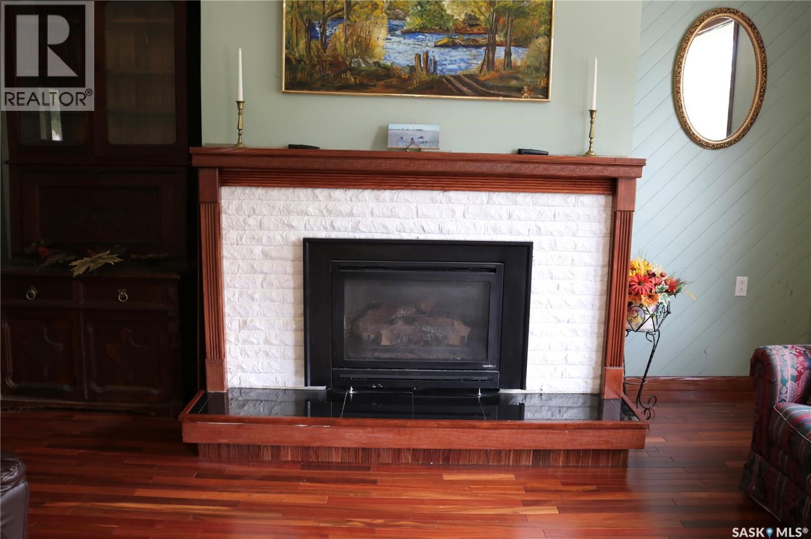 211 Pipestone Avenue, Wawota, SK - Indoor Photo Showing Living Room With Fireplace