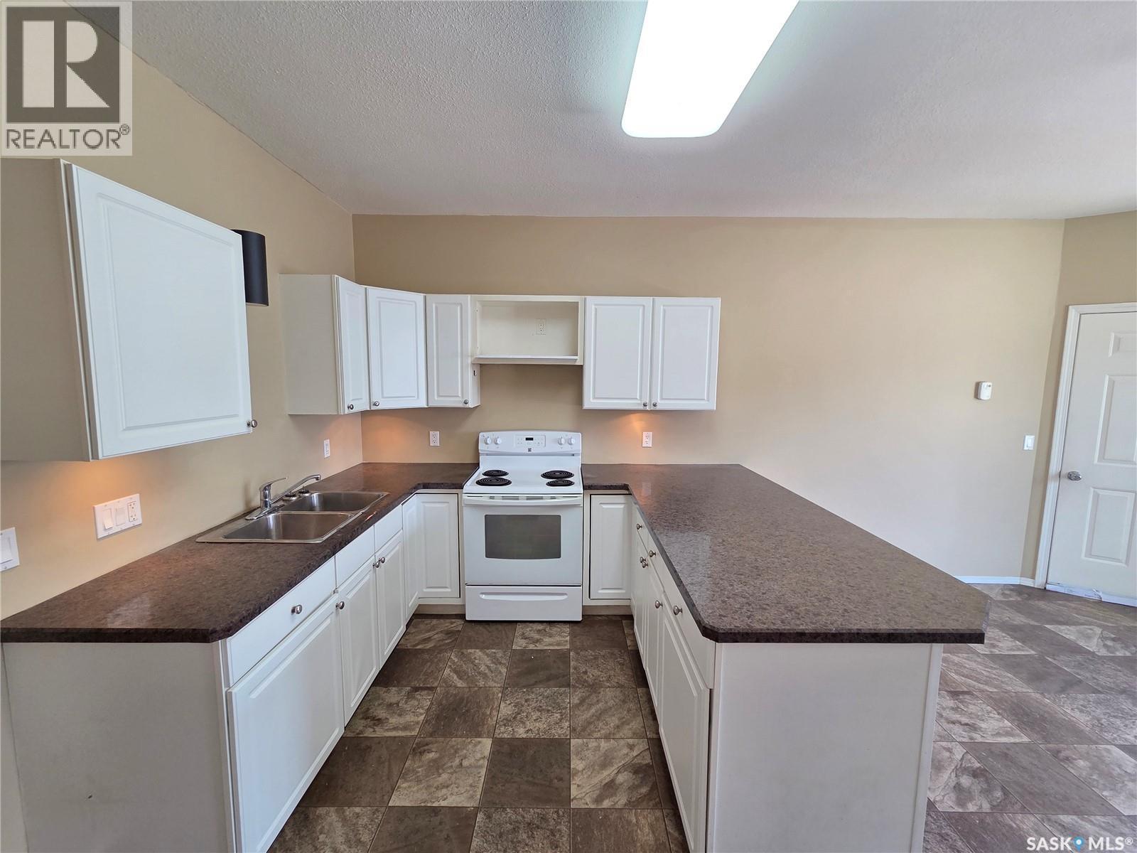 105 Main Street, Wawota, SK - Indoor Photo Showing Kitchen With Double Sink