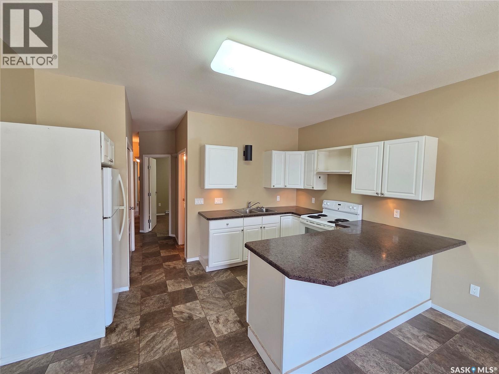 105 Main Street, Wawota, SK - Indoor Photo Showing Kitchen With Double Sink