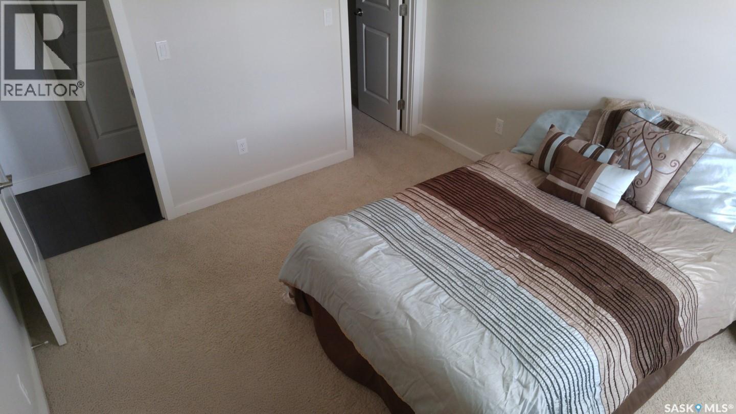 207 211 Ledingham Street, Saskatoon, SK - Indoor Photo Showing Bedroom