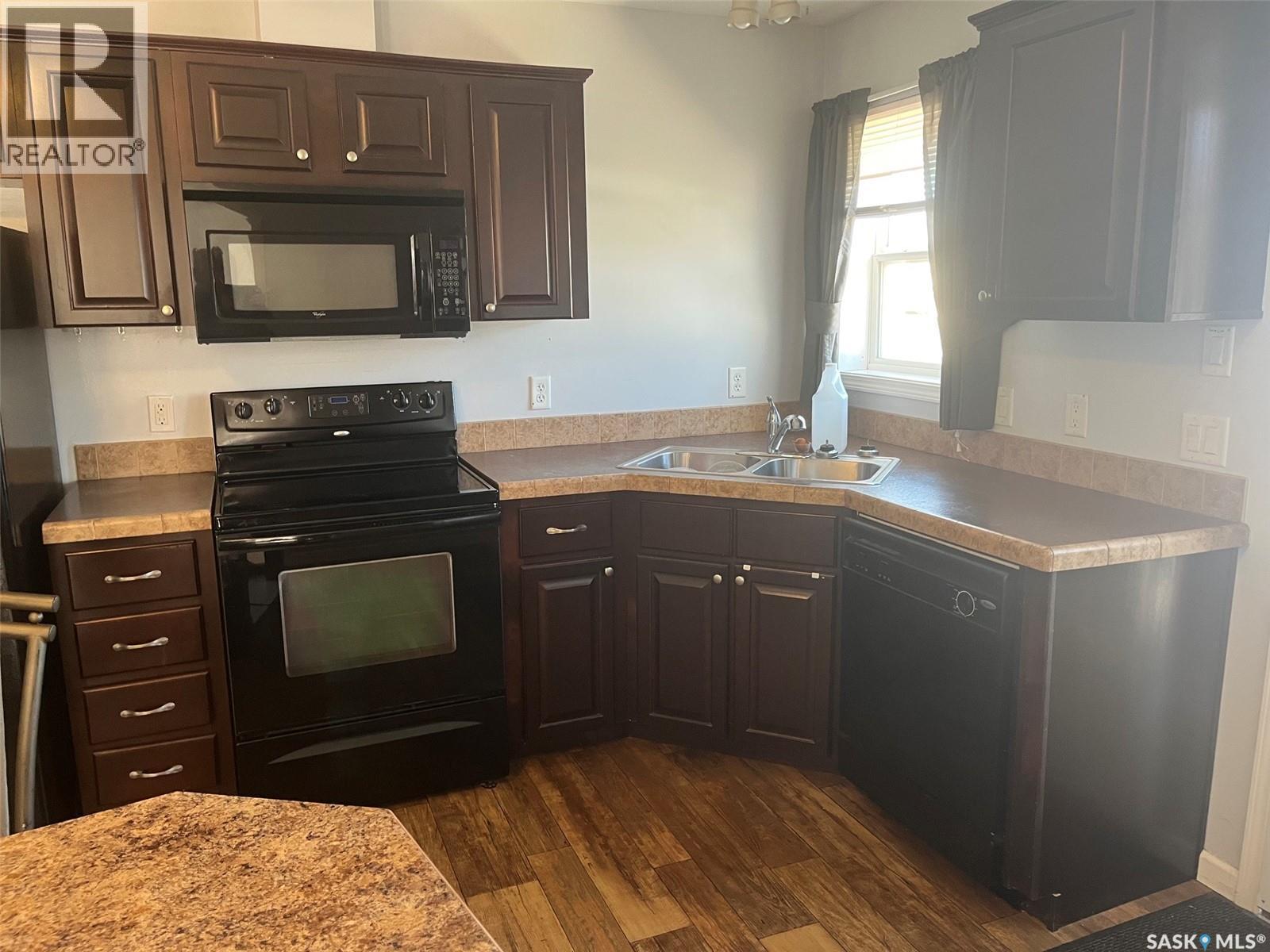 320 3Rd Avenue W, Christopher Lake, SK - Indoor Photo Showing Kitchen With Double Sink