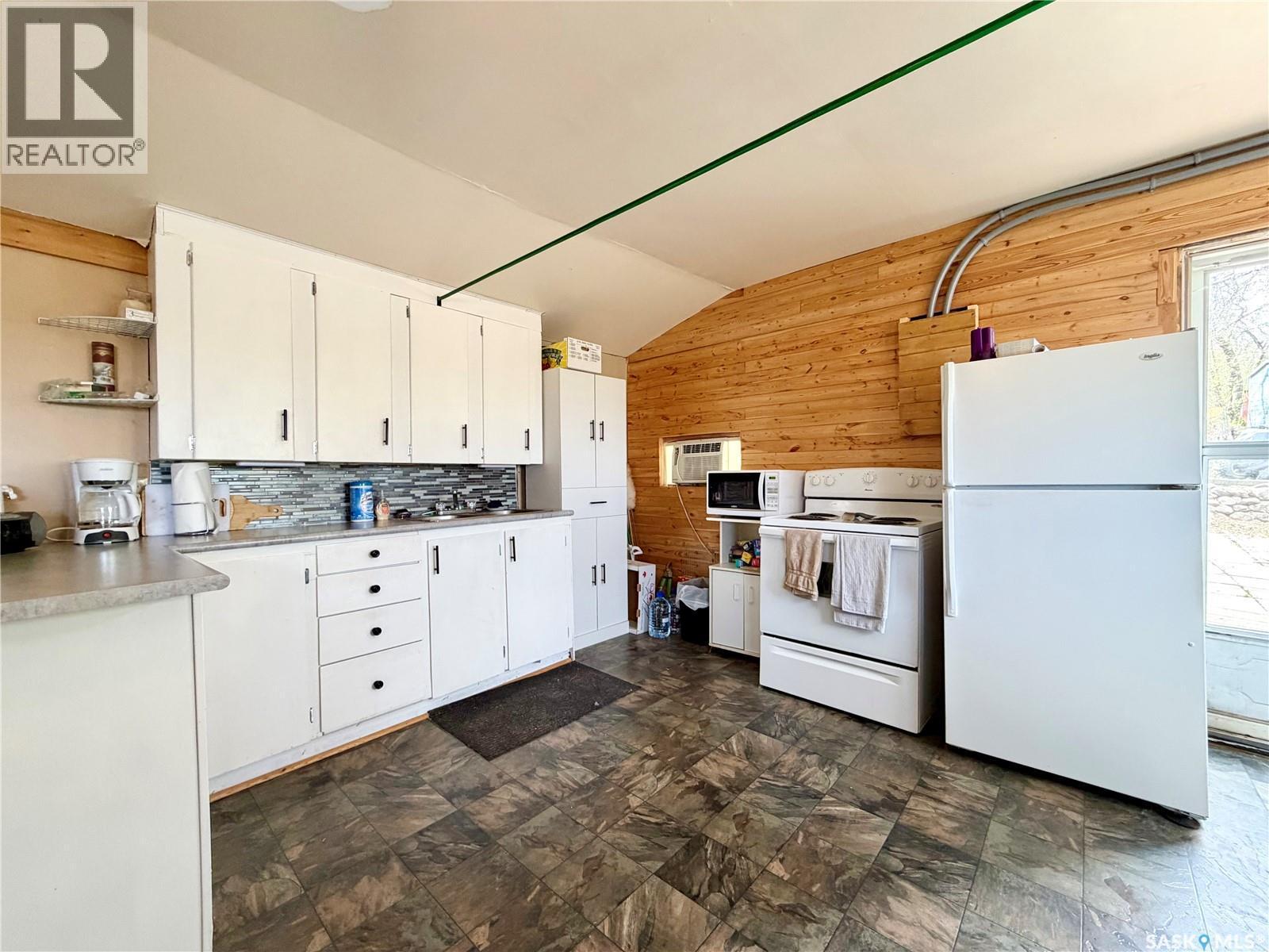 51 Lakeview Road, Grandview Beach, SK - Indoor Photo Showing Kitchen With Double Sink