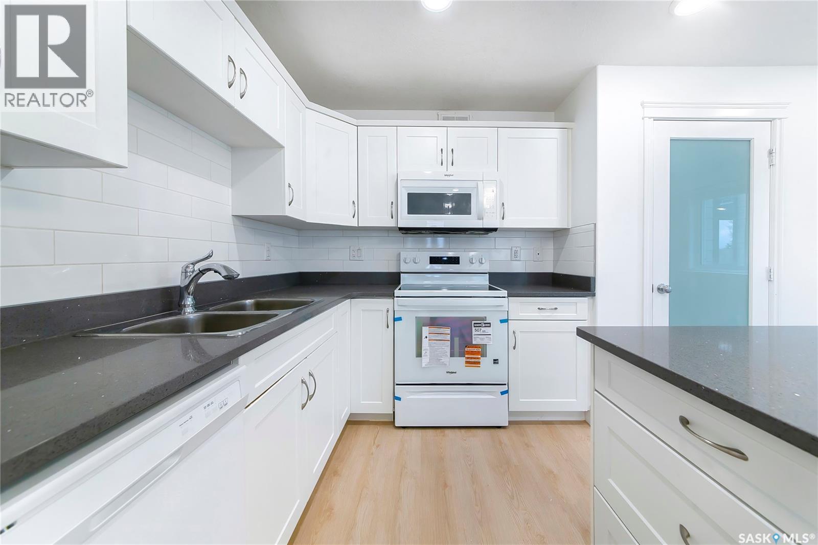 501 110 Akhtar Bend, Saskatoon, SK - Indoor Photo Showing Kitchen With Double Sink