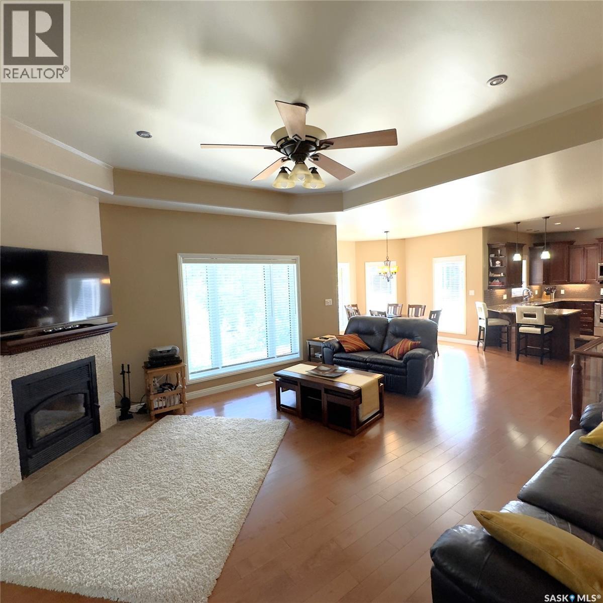 82 Estates Drive, Elk Ridge, SK - Indoor Photo Showing Living Room With Fireplace