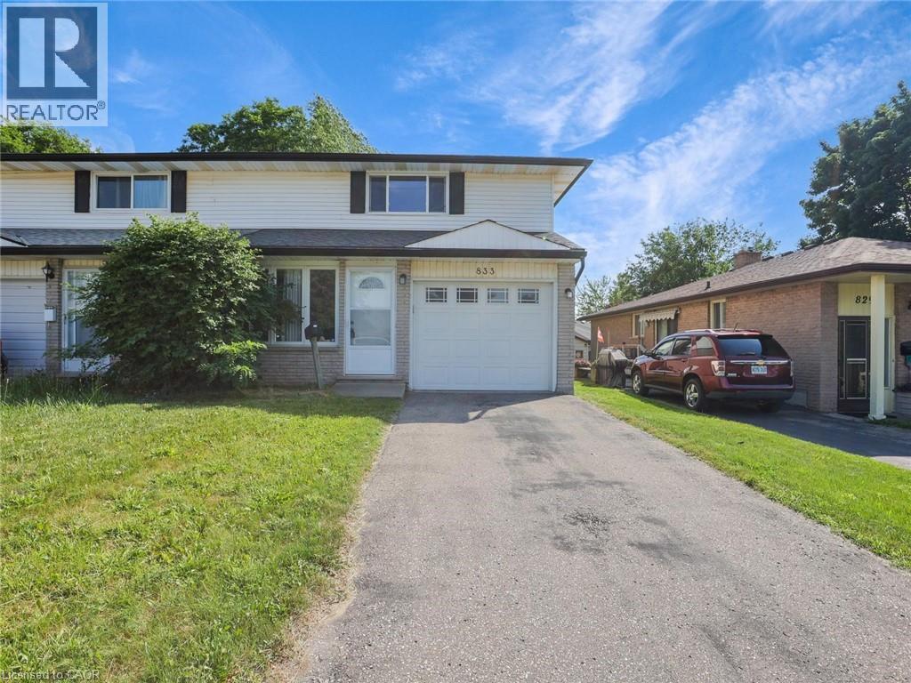 Two-story residence featuring light-colored siding, a dark roofline, and contrasting black window shutters - 833 Doon Village Road, Kitchener, ON - Outdoor With Facade