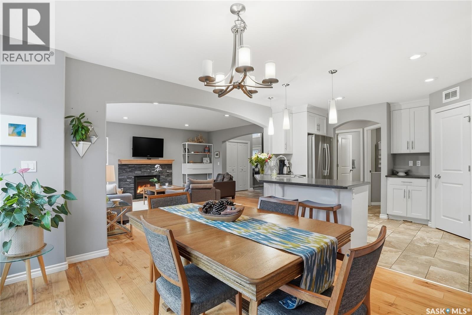 215 Whalley Crescent, Saskatoon, SK - Indoor Photo Showing Dining Room With Fireplace