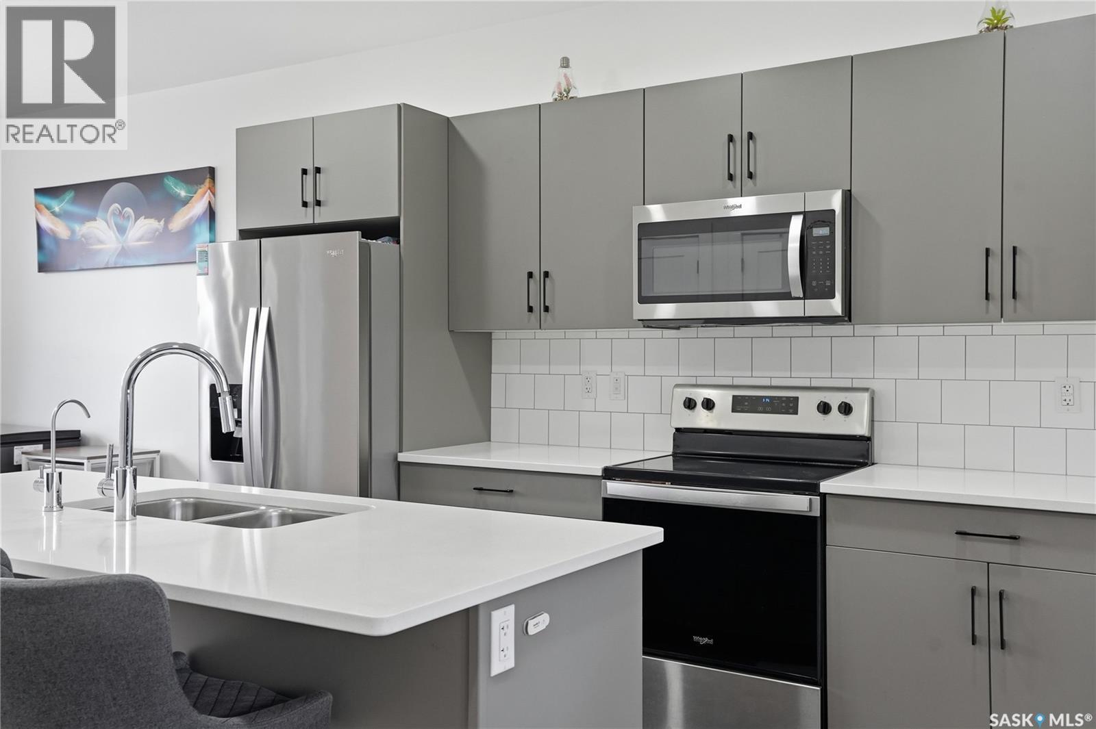187 Rosewood Boulevard E, Saskatoon, SK - Indoor Photo Showing Kitchen With Stainless Steel Kitchen With Double Sink With Upgraded Kitchen