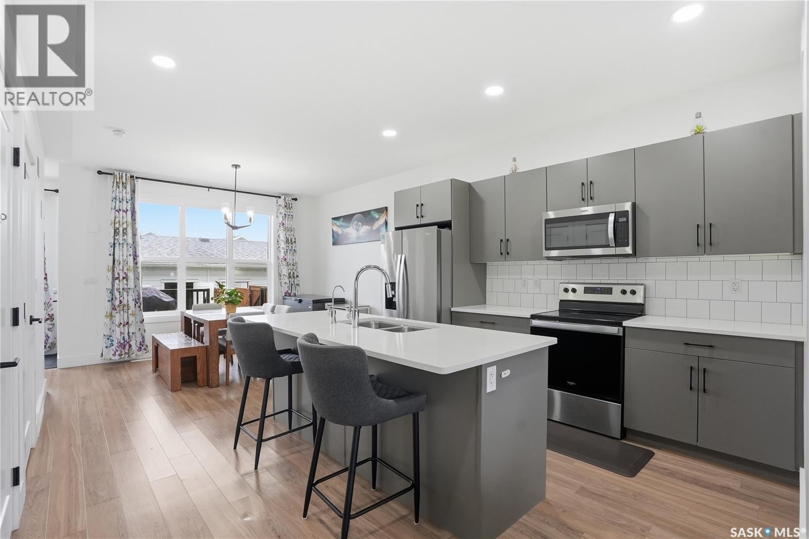 187 Rosewood Boulevard E, Saskatoon, SK - Indoor Photo Showing Kitchen With Stainless Steel Kitchen With Double Sink With Upgraded Kitchen