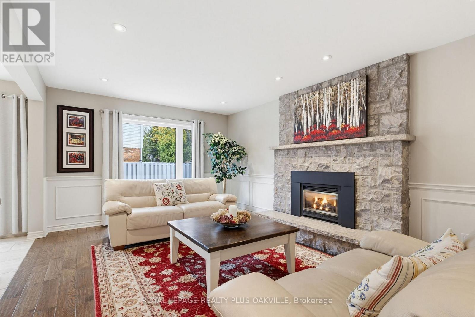 Family room with fireplace - 67 Honeysuckle Crescent, Hamilton, ON - Indoor Photo Showing Living Room With Fireplace