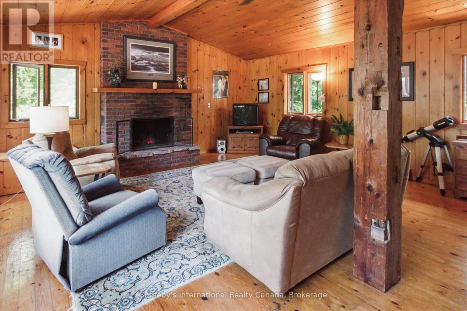 1 Brill'S Island, Nipissing, ON - Indoor Photo Showing Living Room With Fireplace