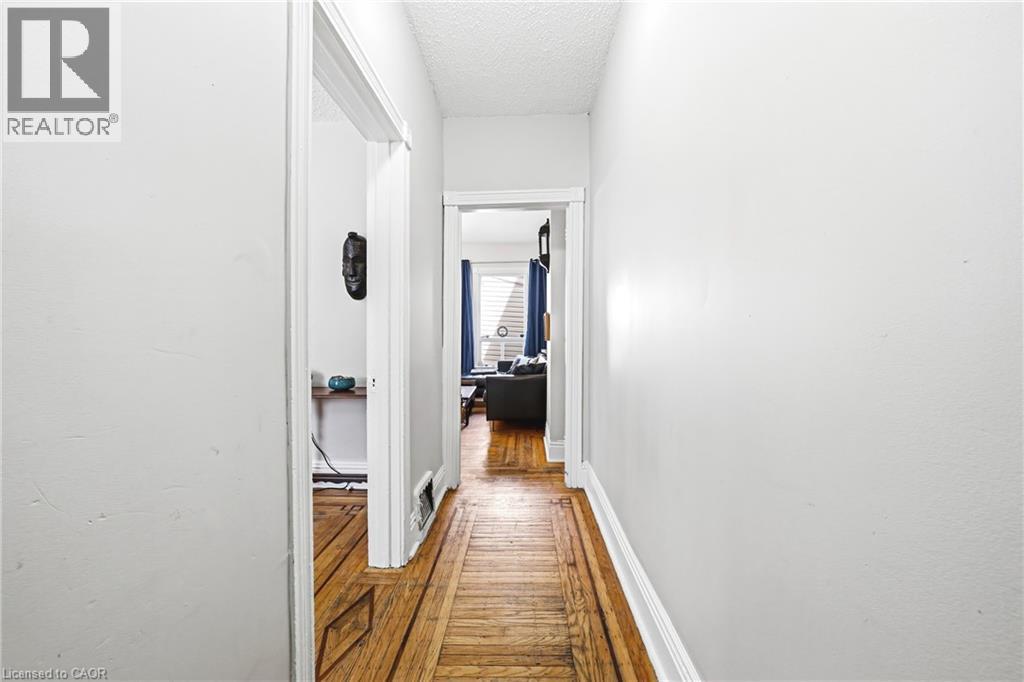 Hallway and Main Level with Inlaid Hardwood - 43 Harvey Street, Hamilton, ON - Indoor Photo Showing Other Room