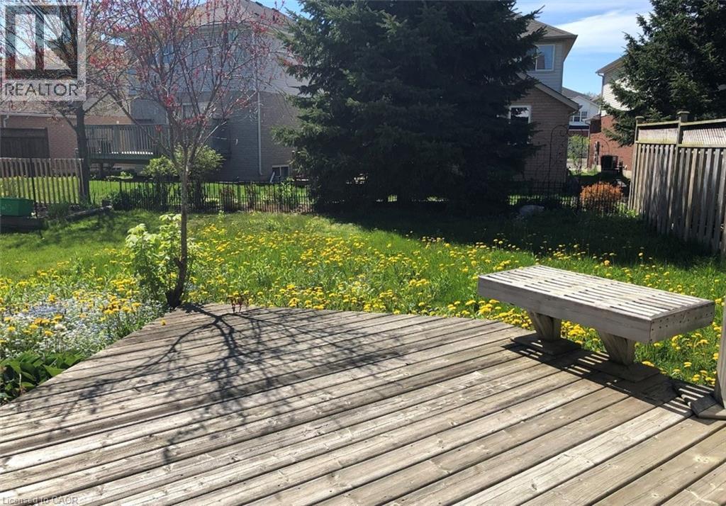Outdoor wood deck with a built-in wood bench - 350 Havendale Crescent, Waterloo, ON - Outdoor With Deck Patio Veranda