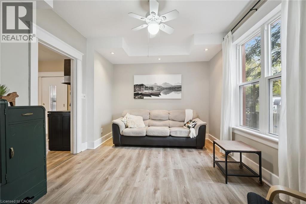 Living area with wood-finish flooring, recessed lighting, and a ceiling fan - 15 Gordon Avenue, Kitchener, ON - Indoor