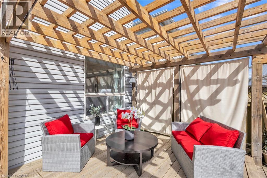 Outdoor wood deck featuring a slatted pergola overhead - 425 Erinbrook Drive, Kitchener, ON - Indoor