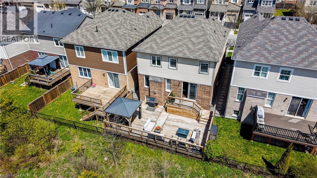Two-story residence featuring a wood deck with a built-in pergola structure - 19 Shoreacres Drive, Kitchener, ON - Outdoor