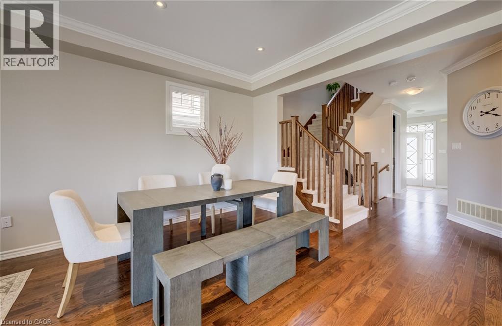 Hardwood-style flooring throughout the main level - 19 Shoreacres Drive, Kitchener, ON - Indoor Photo Showing Dining Room