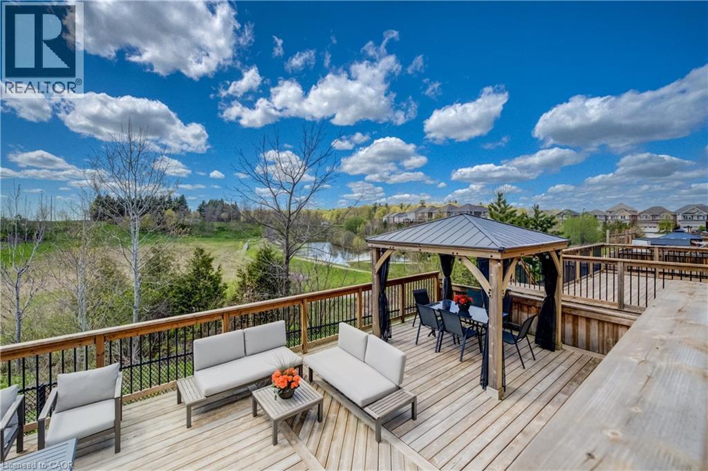 Expansive multi-level wood deck featuring a covered gazebo with dining space - 19 Shoreacres Drive, Kitchener, ON - Outdoor With Deck Patio Veranda With View