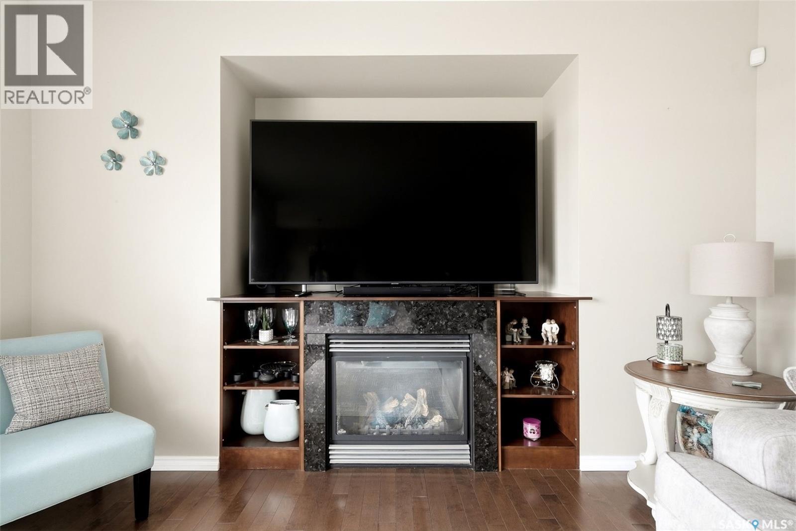 6902 Maple Vista Drive, Regina, SK - Indoor Photo Showing Living Room With Fireplace