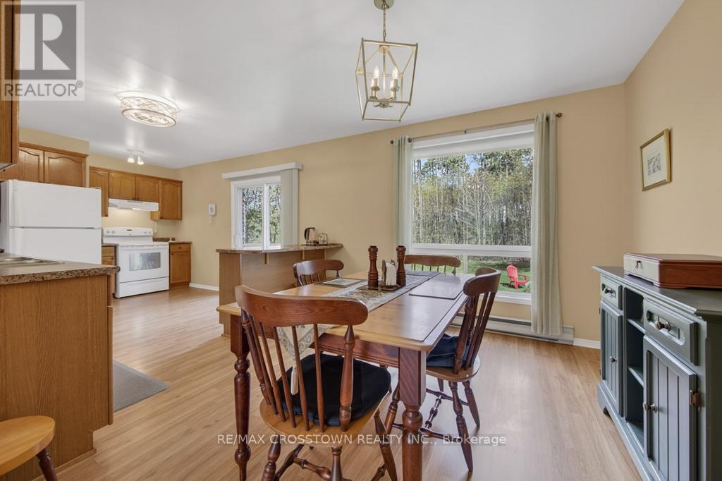 Diningroom and Open Kitchen - 50 Withall Grove, Tiny, ON - Indoor Photo Showing Dining Room