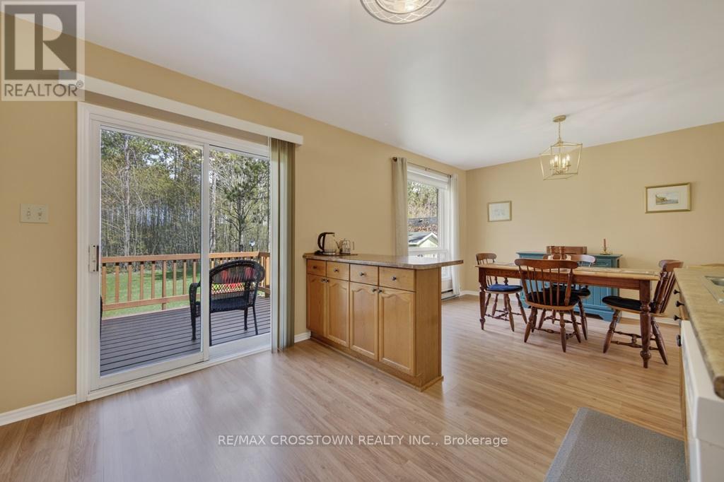 Breakfast Island and Walkout - 50 Withall Grove, Tiny, ON - Indoor Photo Showing Other Room