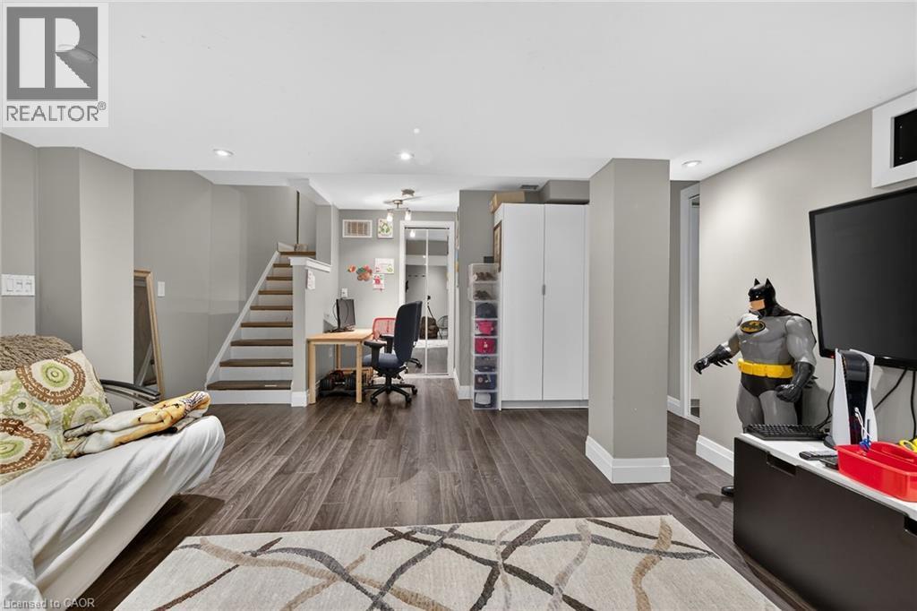 Open concept room featuring wood-finish flooring, recessed lighting, and a neutral wall palette - 4236 Prudham Avenue, Burlington, ON - Indoor