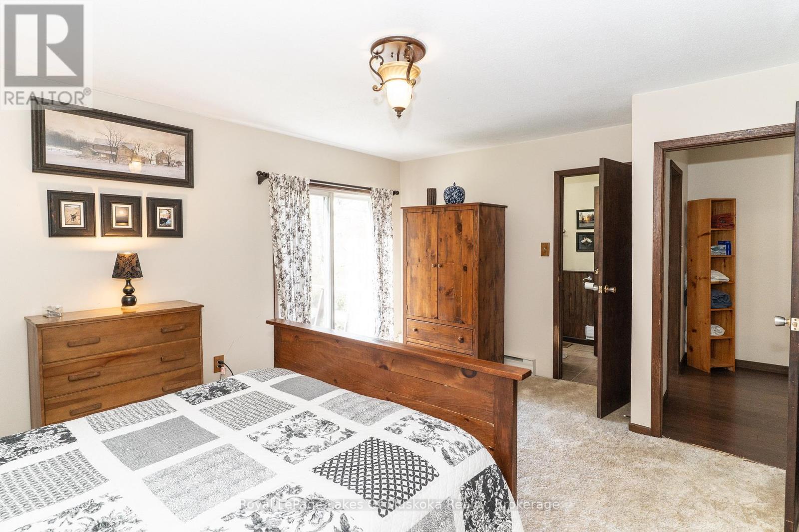 Walkout to deck - 555 Wagner Street, Gravenhurst (Muskoka (S)), ON - Indoor Photo Showing Bedroom
