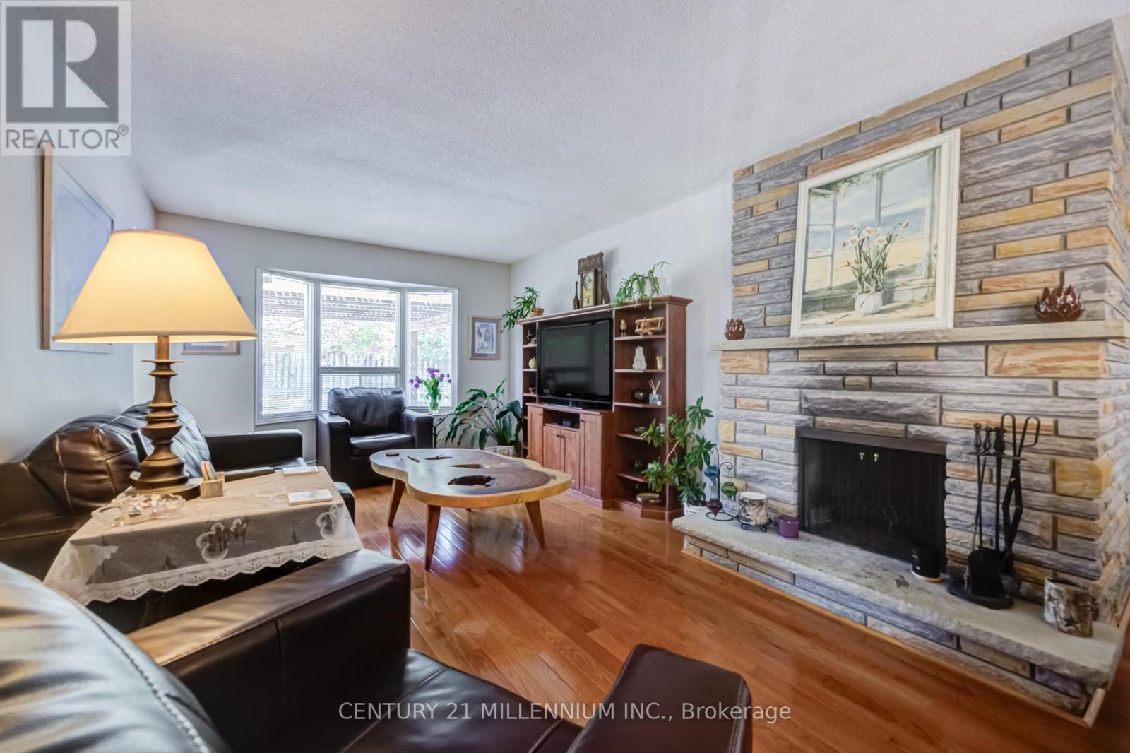 7220 Danton Promenade, Mississauga, ON - Indoor Photo Showing Living Room With Fireplace