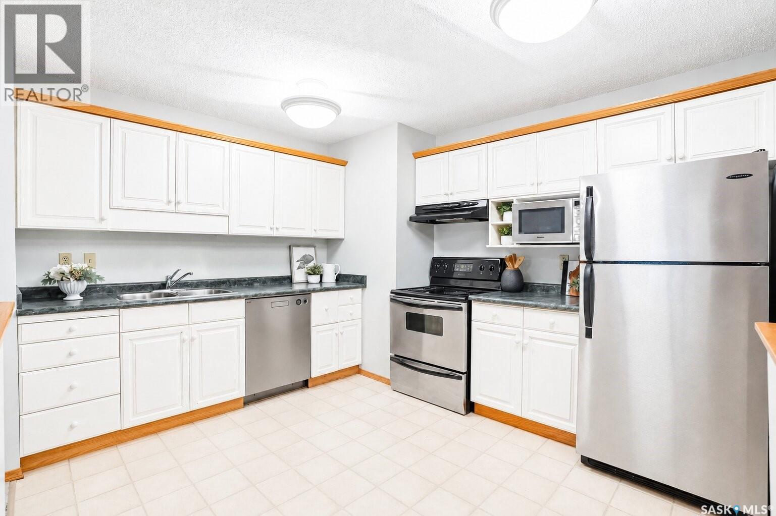 101 410 Main Street, Saskatoon, SK - Indoor Photo Showing Kitchen With Double Sink