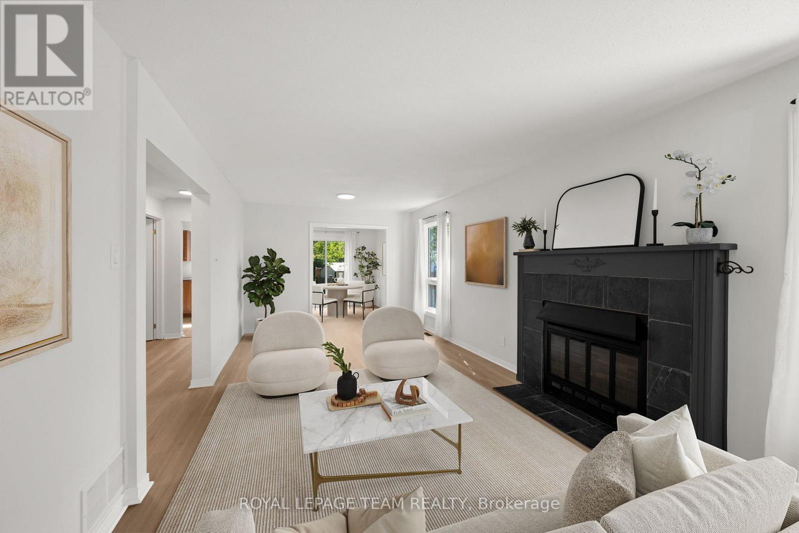 This living room has been virtually staged. - 93 Hewitt Way, Ottawa, ON - Indoor Photo Showing Living Room With Fireplace