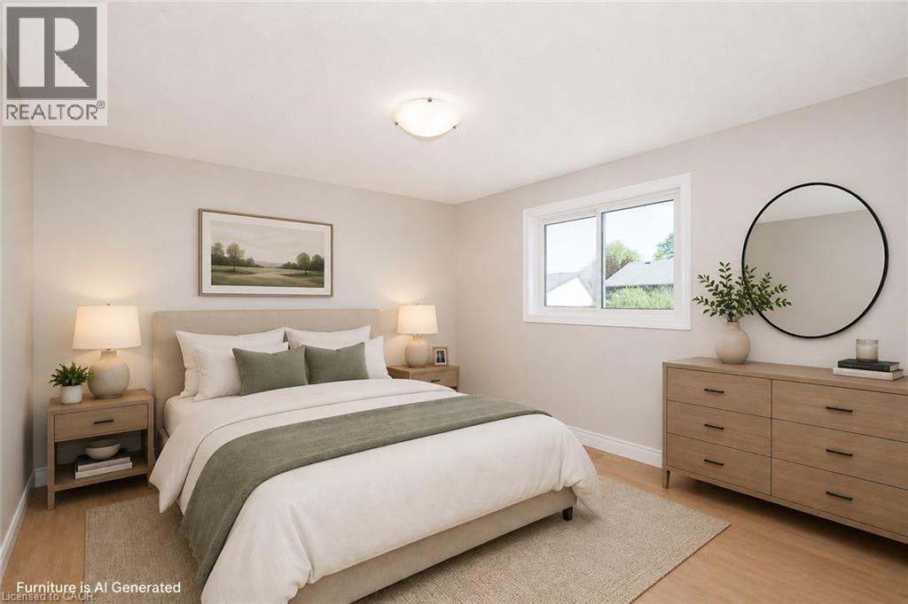 Bedroom featuring neutral wall colors, wood-finish flooring, a contemporary ceiling light fixture, a sliding window with white trim, and white baseboards - 27 Scenic Wood Crescent, Kitchener, ON - Indoor Photo Showing Bedroom