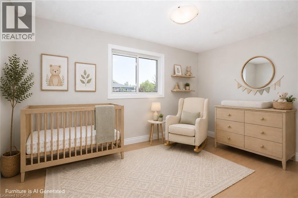 Naturally lit interior space featuring light-colored walls and wood-finish flooring - 27 Scenic Wood Crescent, Kitchener, ON - Indoor Photo Showing Bedroom