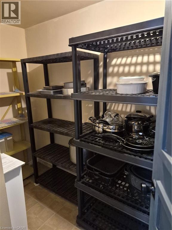 Compact storage area featuring ample shelving - 27 Scenic Wood Crescent, Kitchener, ON -