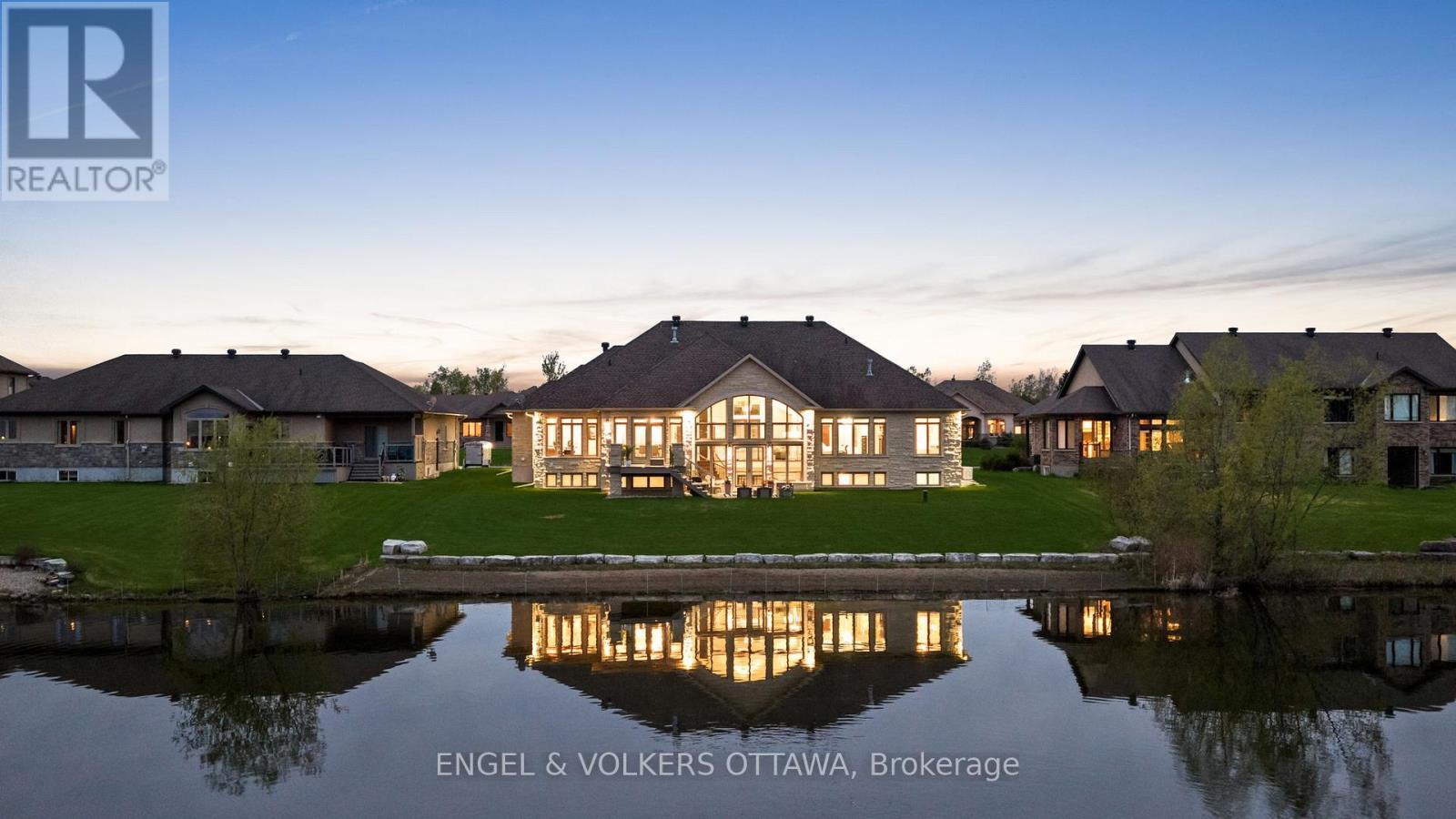 Lawn has been digitally enhanced - 1457 Waters Edge Way, Ottawa, ON - Outdoor With Body Of Water