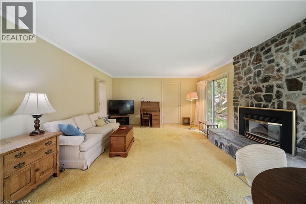 133 Mccall Crescent, Simcoe, ON - Indoor Photo Showing Living Room With Fireplace