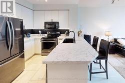 RENOVATED KITCHEN WITH QUARZ COUNTERTOPS -