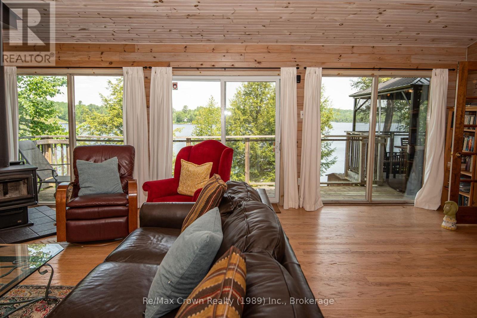 Patio doors to access front deck - 294 Everett Drive, Parry Sound Remote Area (Restoule), ON - Indoor Photo Showing Living Room